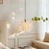 French cream style hanging line lamp, modern and simple bedroom, room lifting headboard pendant lamp, creative high-end feeling, mysterious light off